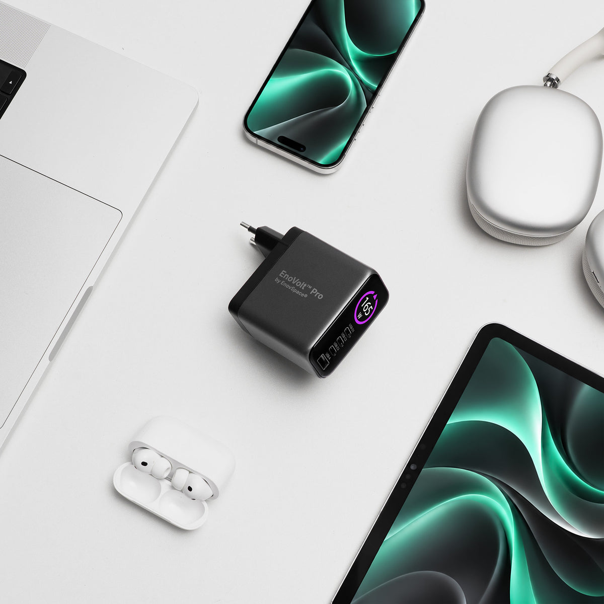 EnoVolt Pro 165W next to a laptop, a tablet, a phone and wireless earbuds